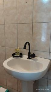 a bathroom sink with a faucet on top of it at Hospedagem Em Santana de Parnaíba 67 in Santana de Parnaíba