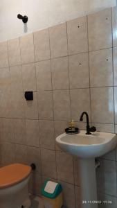 a bathroom with a sink and a toilet at Hospedagem Em Santana de Parnaíba 67 in Santana de Parnaíba