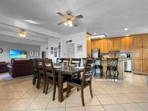 a dining room and kitchen with a table and chairs at Remodeld5BR Modern Retreat with Covered Pool in El Paso