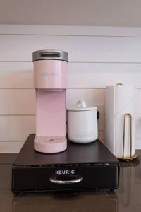 a pink blender sitting on top of a black box at New Cowgirl Shipping Container Home in Alpine
