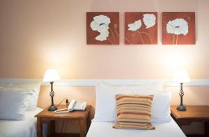 Postelja oz. postelje v sobi nastanitve Hotel Austral Ushuaia