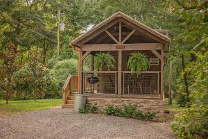 a gazebo with a dog in it at Celina Cabin Nature Cabin Near Downtown Chattanooga in Chattanooga
