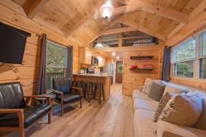 a living room and kitchen of a tiny house at Celina Cabin Nature Cabin Near Downtown Chattanooga in Chattanooga