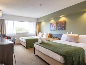 Cama ou camas em um quarto em Auckland Rose Park Hotel mais 37 fotos