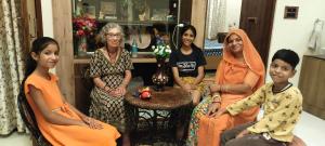 a group of women and children sitting in a room at Rajputana Heritage Ranthambhore Home Stay in Sawāi Mādhopur