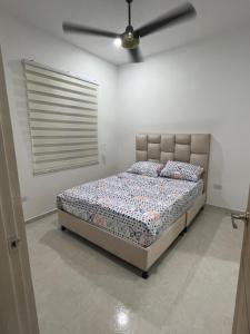 Postel nebo postele na pokoji v ubytování Linda casa en el espinal tolima