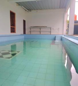 The swimming pool at or close to Kampung Istal Villa Pamijahan