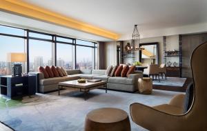 a living room with a couch and a table at Grand Hyatt Shenyang in Shenyang