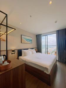 מיטה או מיטות בחדר ב-Apec Phú Yên SeaView Condotel