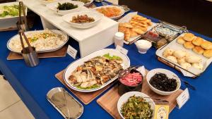 a table with many different dishes of food on it at Toyoko Inn Sendai Higashi-guchi No.1 in Sendai