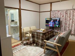 Televizorius ir (arba) pramogų centras apgyvendinimo įstaigoje おばあちゃんち