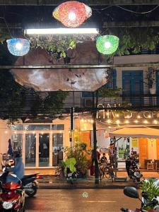 a group of motorcycles parked in front of a building at Phuc Bao Center Local Homestay - 3 mins walk to Old Town in Hoi An