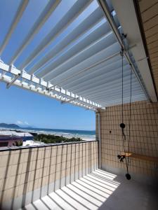 a balcony with a view of the ocean at Cobertura Vista Para o Mar Praia Boraceia-SP Litoral Norte in Boracéia