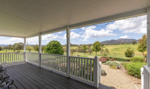 a porch with a view of the mountains at Willow Creek Farm Cottage in Verona
