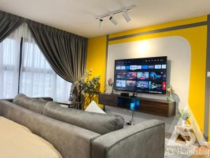 a living room with two couches and a flat screen tv at Arte Cheras Romantic MRT Cheras Wi-Fi Smart Tv AsHome in Kuala Lumpur