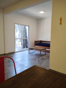 an empty room with a bench and a window at Casa Mar in La Lucila del Mar +8 photos