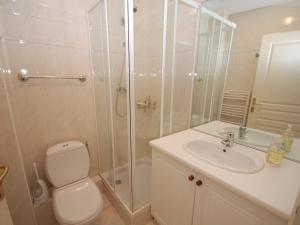 a bathroom with a shower and a toilet and a sink at Superbe 3P en bord de mer avec terrasse et garage à Menton - FR-1-196-248 in Menton +14 photos