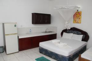 Postel nebo postele na pokoji v ubytování Shanith Guesthouse Negombo