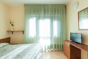 TV a/nebo společenská místnost v ubytování Hotel Fabbrini