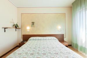 Postel nebo postele na pokoji v ubytování Hotel Fabbrini