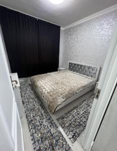 Ліжко або ліжка в номері 2-комнатная квартира на Юнусабад