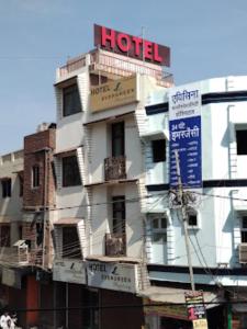 a building with a hotel sign on top of it at Hotel Evergreen Residency , Bhopal in Bhopal