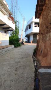 an empty street in front of a building at Hotel Evergreen Residency , Bhopal in Bhopal