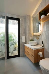 a bathroom with a sink and a mirror at Richmond Sanctuary in Melbourne