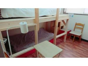a room with a bunk bed with a desk and a chair at The Stay Central Nagasaki / Vacation STAY 5111 in Nagasaki
