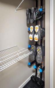 a closet with a rack of shoes and shoes at 2 Bedroom and Wall Bed Mountain Getaway Ski In Ski Out Condo with Hot Pools Sleeps 8 in Panorama
