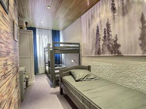 a bedroom with two bunk beds and a wall mural at Grand appartement spacieux pour 5 pers., balcon, accès direct aux pistes, Wifi - FR-1-455-167 in La Plagne