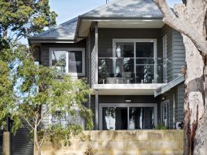 a house with black siding and windows at Park View in Margaret River Town