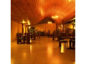 a hallway with tables and chairs in a restaurant at O'sinkirri in Nairobi