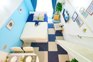 a small room with a bed and a staircase at SC 103 Cozy Private Stay with Loft Near Station Free WiFi in Tokyo