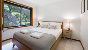 Postel nebo postele na pokoji v ubytování Cedar Corner