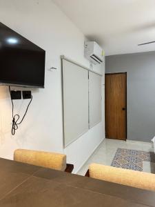 TV a/nebo společenská místnost v ubytování Apartamentos 31