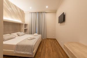 Postel nebo postele na pokoji v ubytování Top Floor Colosseo Guesthouse