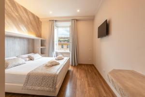 Postel nebo postele na pokoji v ubytování Top Floor Colosseo Guesthouse