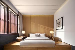 Jing's Residence Pingyao客房内的一张或多张床位