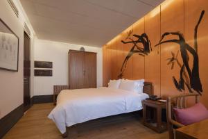 Jing's Residence Pingyao客房内的一张或多张床位