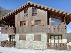 a large wooden house with a balcony at Appartement Les Carroz d'Arâches, 4 pièces, 6 personnes - FR-1-572-36 in Arâches-la-Frasse