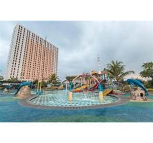a water park with a water slide in front of a building at OYO Life 93374 Andira Inn in Depok