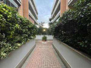 a brick walkway between two tall buildings at Love Dream House in Rome