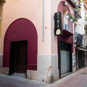 a building with two doors and a sign on it at Residencial Art Brut in Castellón de la Plana