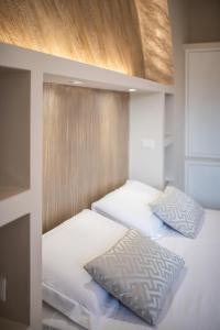 Postel nebo postele na pokoji v ubytování Top Floor Colosseo Guesthouse