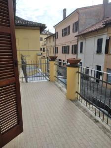 an open door to a courtyard with buildings at SeaHarbour Pesaro in Pesaro