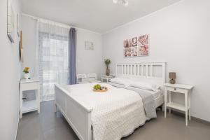 Łóżko lub łóżka w pokoju w obiekcie Apartamenty Gardenia Seaside by Noclegi Renters