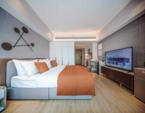 Postel nebo postele na pokoji v ubytování BORUISI Executive Apartment