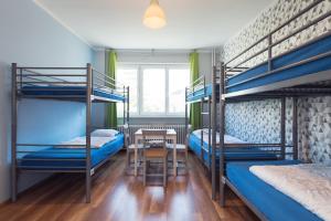 Postel nebo postele na pokoji v ubytování Patio Hostel Dorms