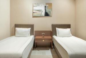 En eller flere senge i et værelse på Arin Resort Bodrum